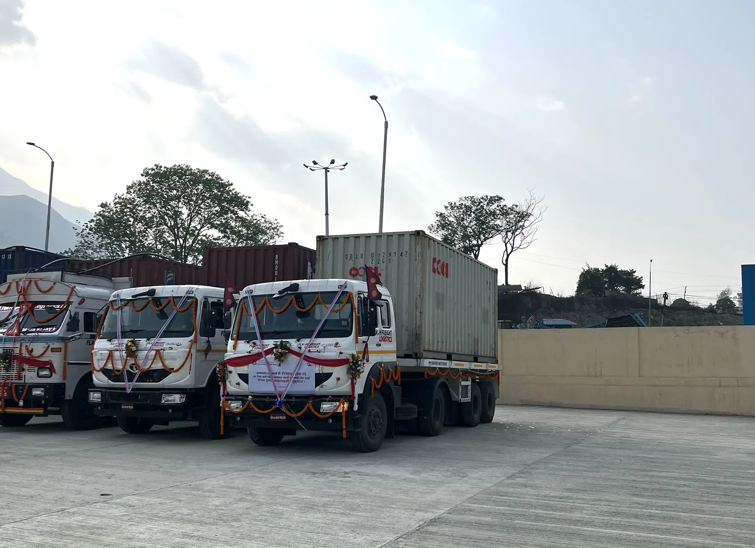 Garlanded container trucks at the Chobar dry port